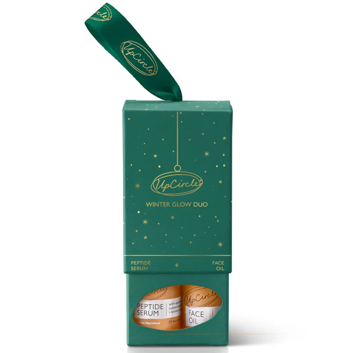 UpCircle Winter Glow Duo packaging with two bottles inside on a white background